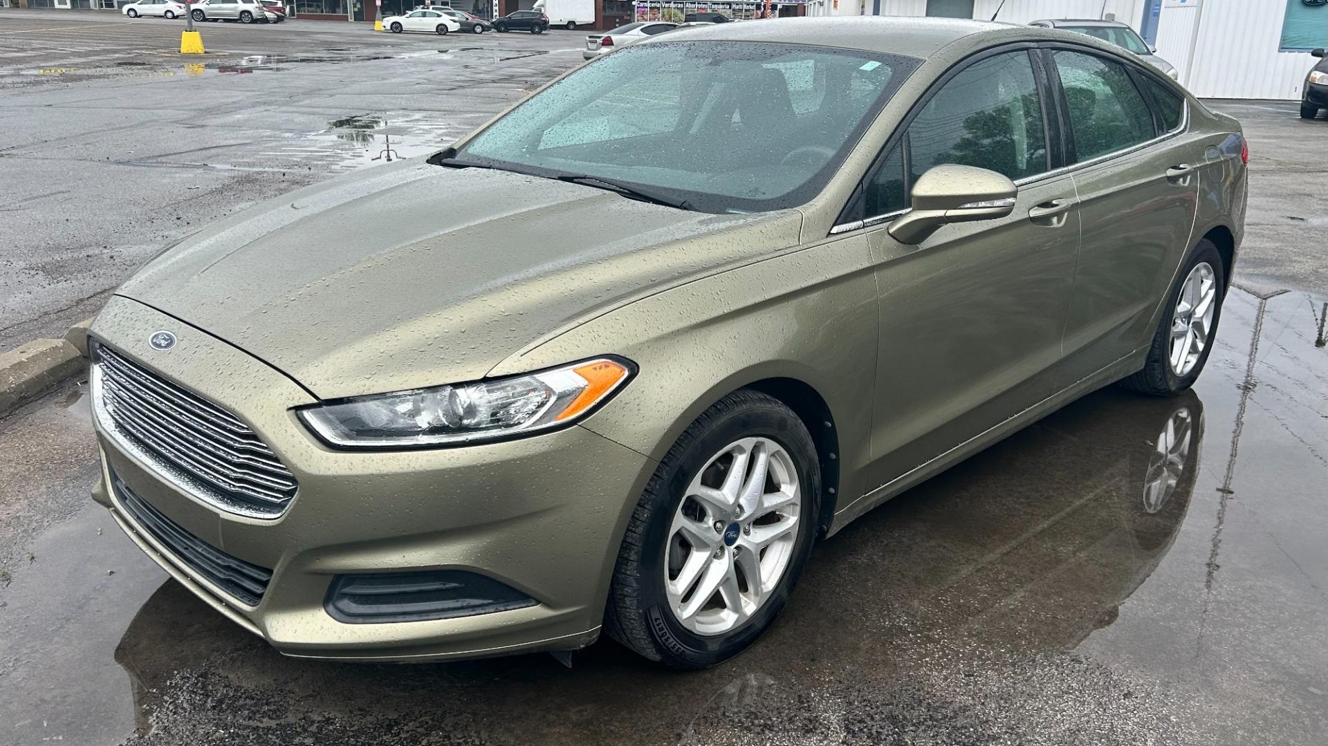 2013 GREEN /Black Ford Fusion (3FA6P0H73DR) , located at 2710A Westlane Rd., Indianapolis, IN, 46268, (317) 291-2000, 39.885670, -86.208160 - Photo#2